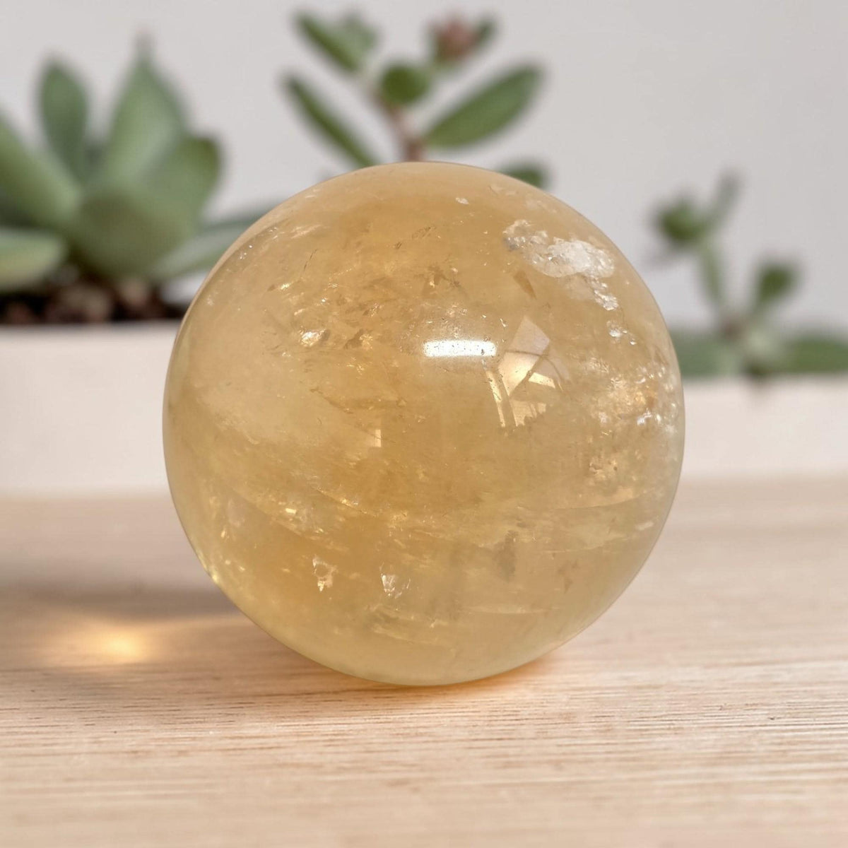 Natural yellow quartz crystal sphere with glossy surface, 72mm