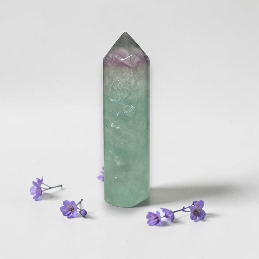 Green fluorite tower with purple-tinted top, polished crystal point, faceted prism shape
