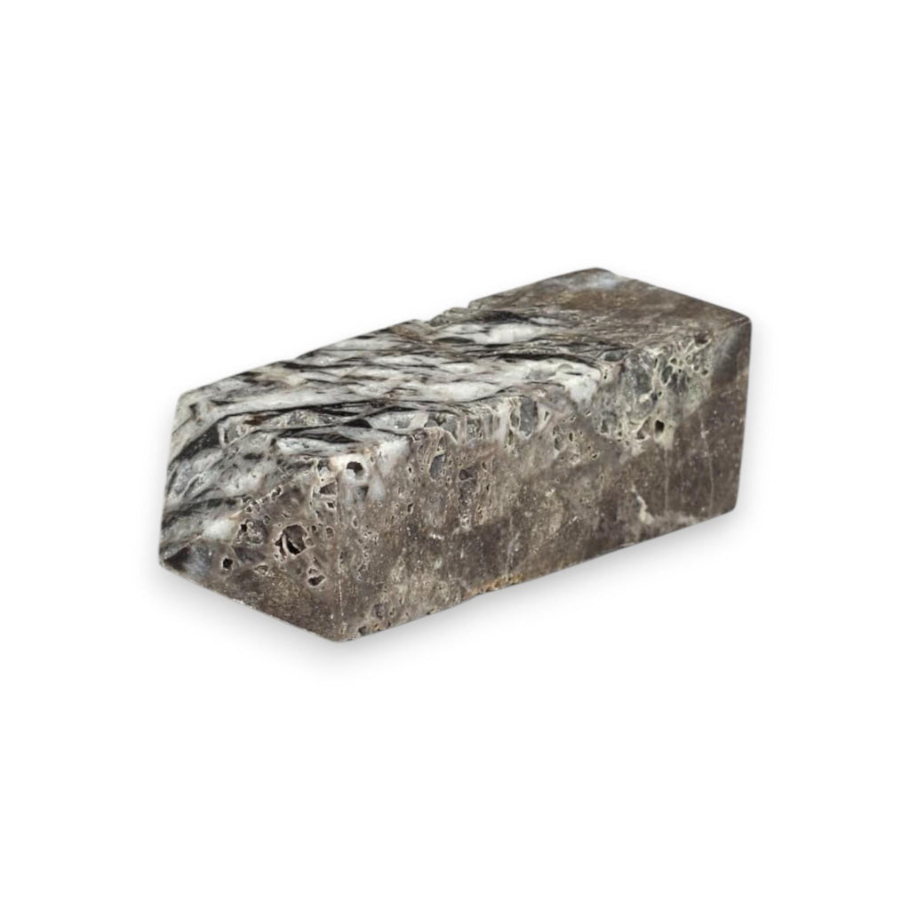 Natural sphalerite crystal tower, dark gray with lighter marbling and pitted texture