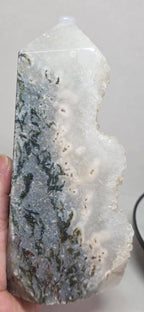 Moss agate drusy geode tower, close view of white druzy crystal with dark green veins