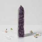 Amethyst drusy crystal tower, medium-dark purple druzy surface with clear quartz cap