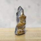 Freeform ocean jasper flame crystal standing upright, blue-gray stone with gold specks