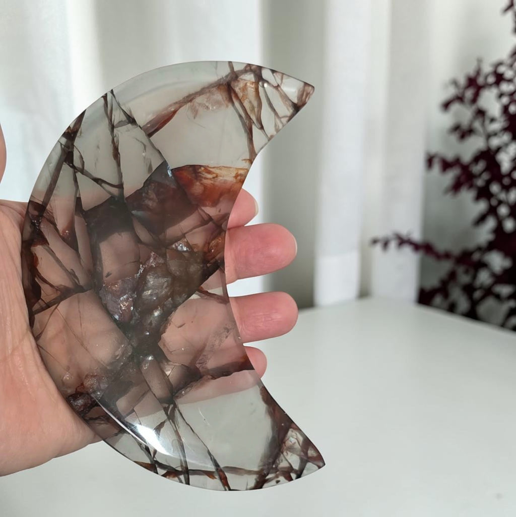 Fire quartz crescent moon with display stand