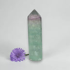 Green and purple rainbow fluorite tower crystal point, polished hexagonal shape
