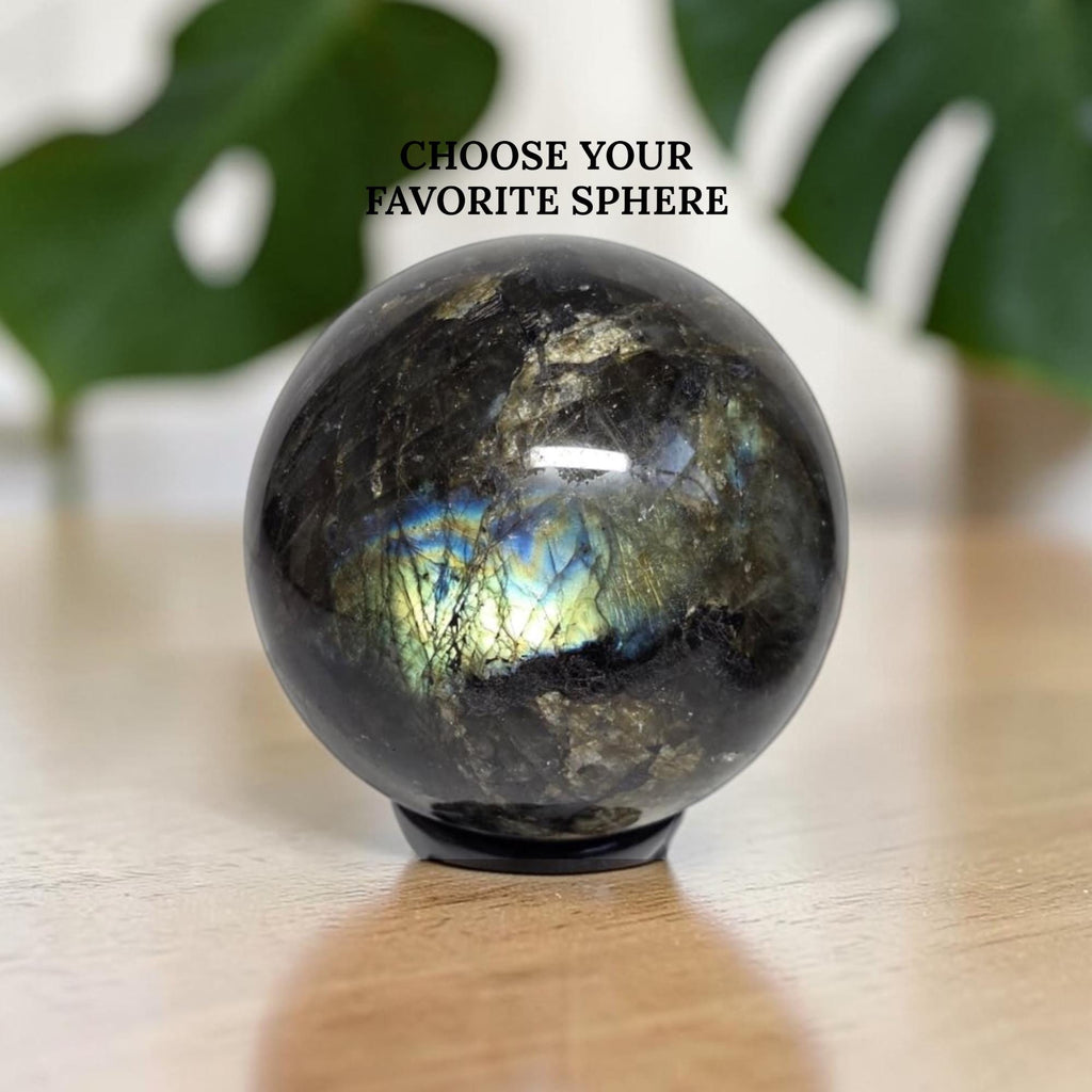 Labradorite crystal sphere, dark stone with blue and gold iridescent flashes