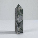 Moss agate crystal obelisk, rectangular tower shape with pointed tip and dark green veining