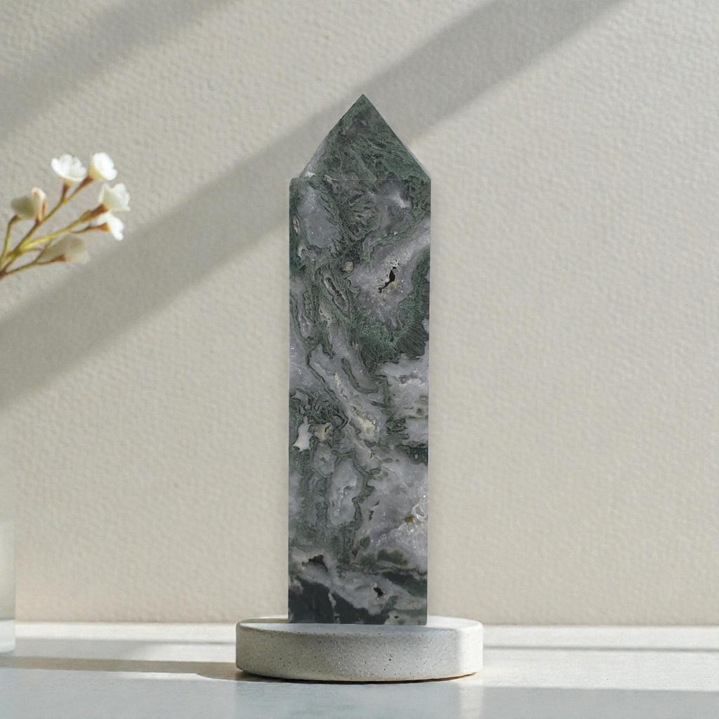 Moss agate crystal obelisk with pointed top, mottled gray stone with green streaks