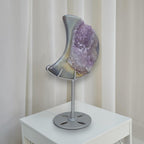 Crescent moon purple druzy agate geode on silver stand with round base, front