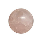 Polished rose quartz sphere in soft pink, glossy surface with internal veining
