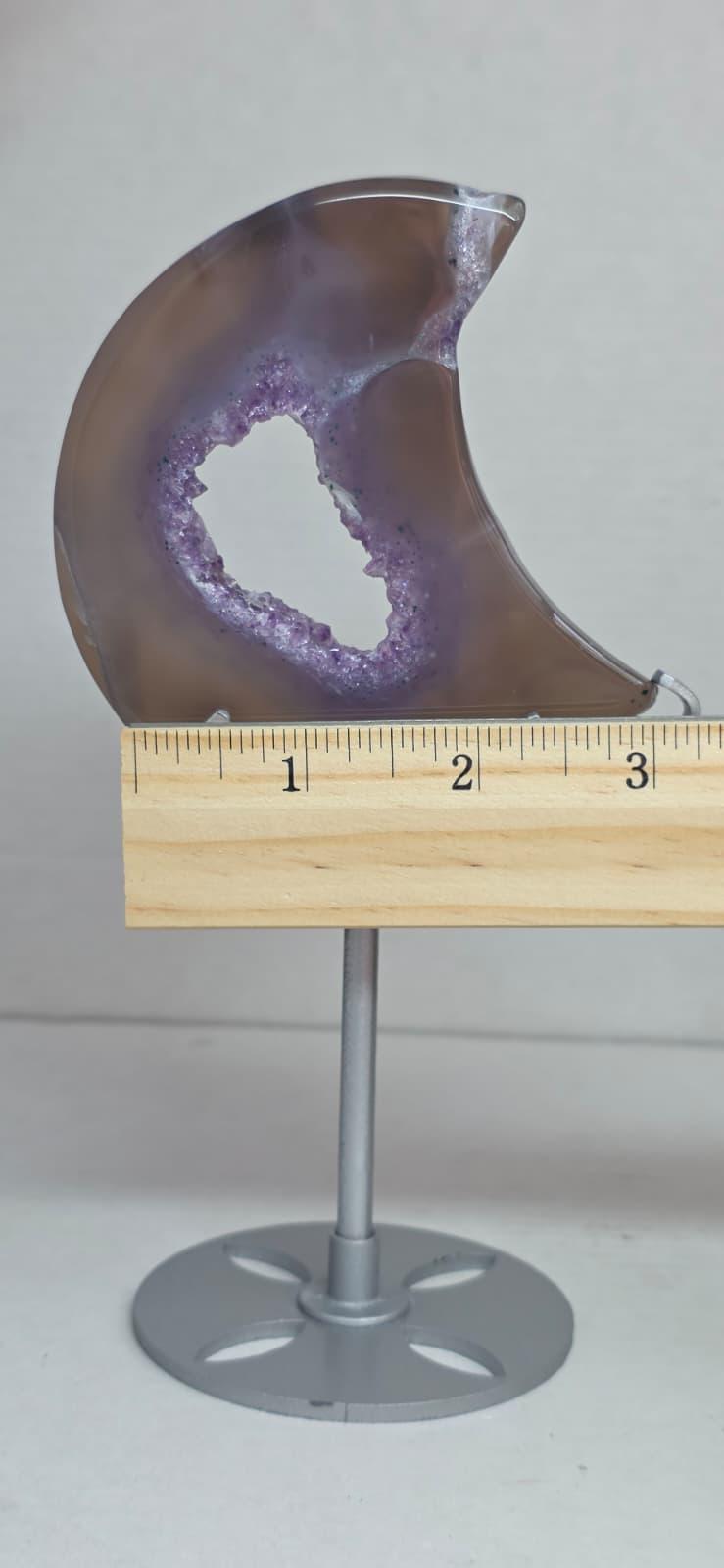 Purple geode crescent moon decor measured with ruler on metal base