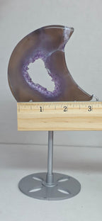 Purple geode crescent moon decor measured with ruler on metal base