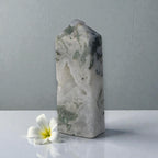 Moss agate crystal obelisk with white sparkly druzy pocket and green mossy inclusions, tall.