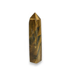 Tiger eye obelisk crystal tower, gold-brown with smoky blue streaks, faceted pointed top