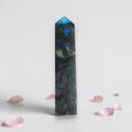Labradorite crystal tower, dark gray with vivid blue iridescence, pointed tip