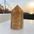 Sunstone obelisk point tower stone, polished brown-gold with faceted sides
