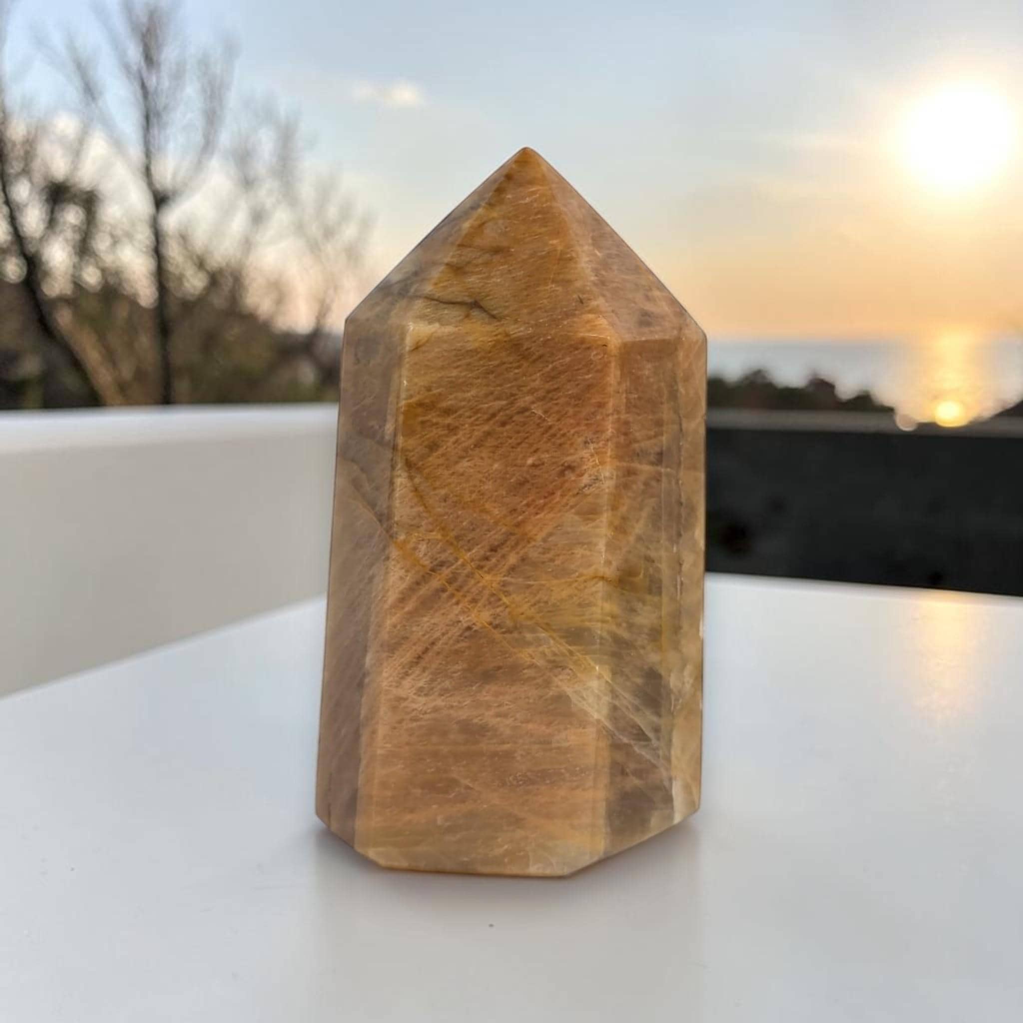 Sunstone obelisk point tower stone, polished brown-gold with faceted sides