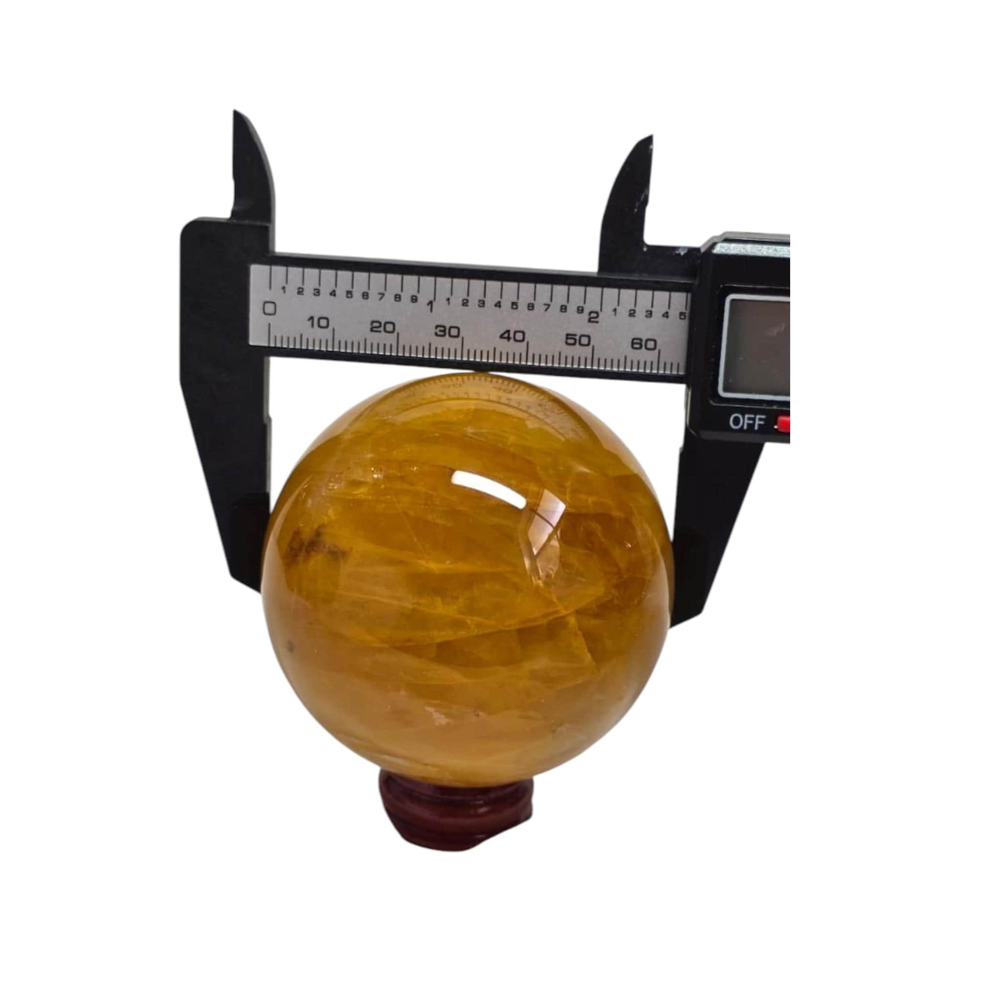 Crystal sphere measured with caliper; about 65 mm diameter