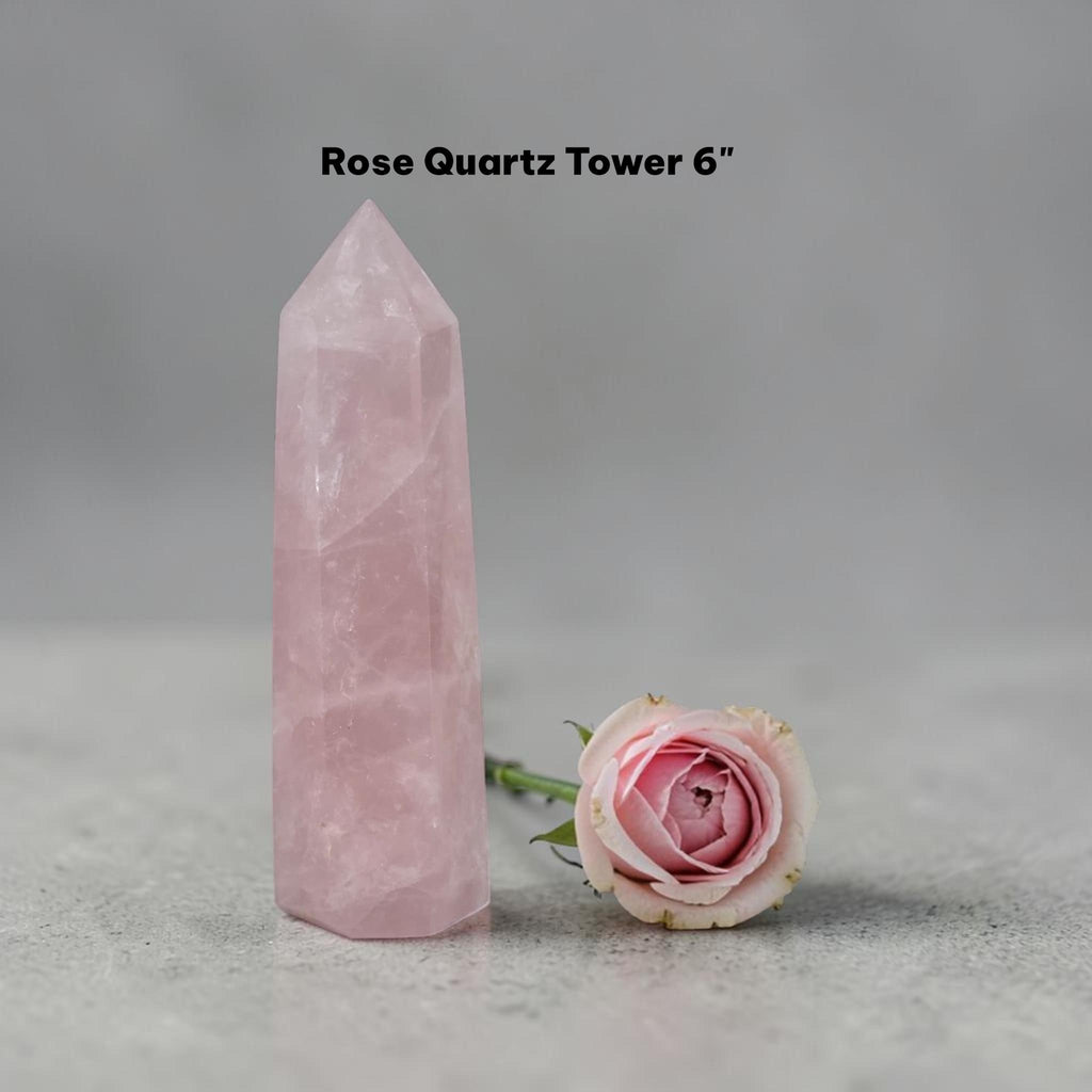 Rose quartz crystal tower in pale pink, angular point with polished sides