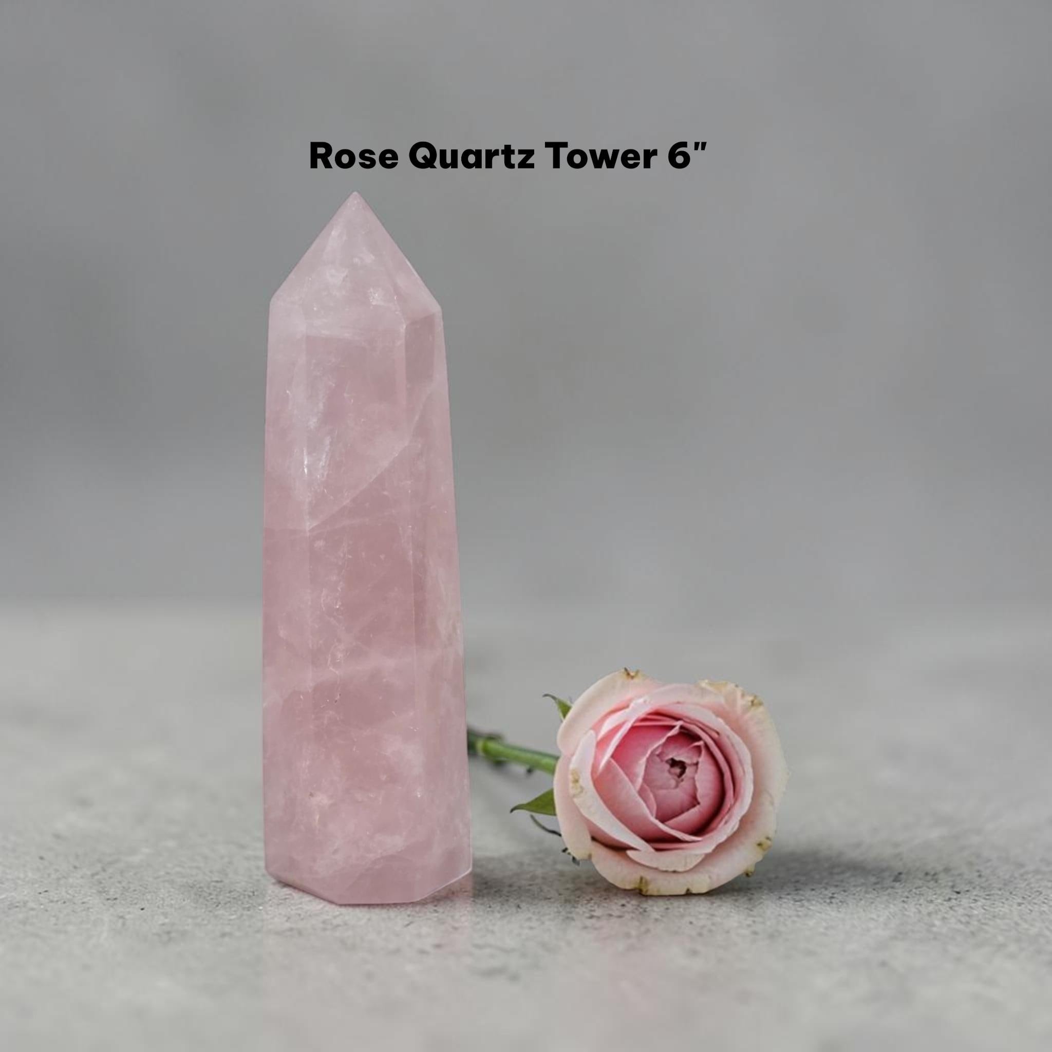 Rose quartz crystal tower in pale pink, angular point with polished sides