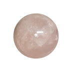 Polished rose quartz sphere, pale pink with glossy highlights and mineral streaks