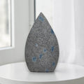 Teardrop polished gift stone, gray with scattered blue spots, pointed top