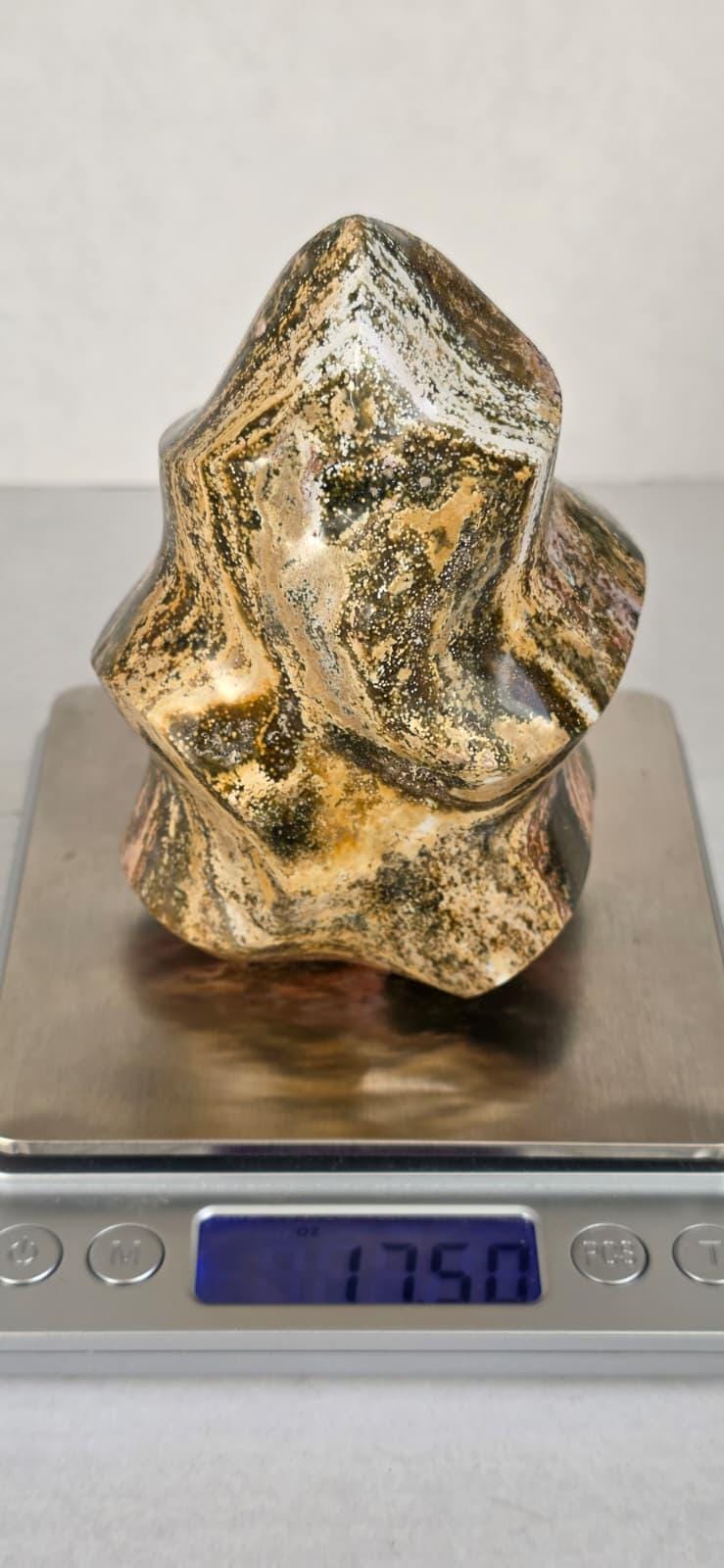Ocean jasper flame crystal specimen on scale, gold and dark mottled freeform with shine.