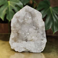 White quartz drusy geode with sparkling crystal cluster, natural mineral decor.
