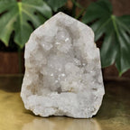 White quartz drusy geode with sparkling crystal cluster, natural mineral decor.