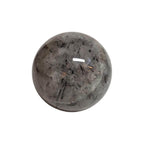 Polished quartz sphere with black needle inclusions, smoky gray tone, 66mm