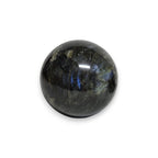 Polished labradorite sphere with subtle blue sheen in dark stone