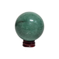 Green crystal sphere on maroon round base, smooth glossy orb