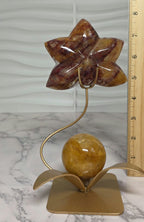 Fire Quartz orchid carving with gold stand ruler measurement showing ~8 inches height
