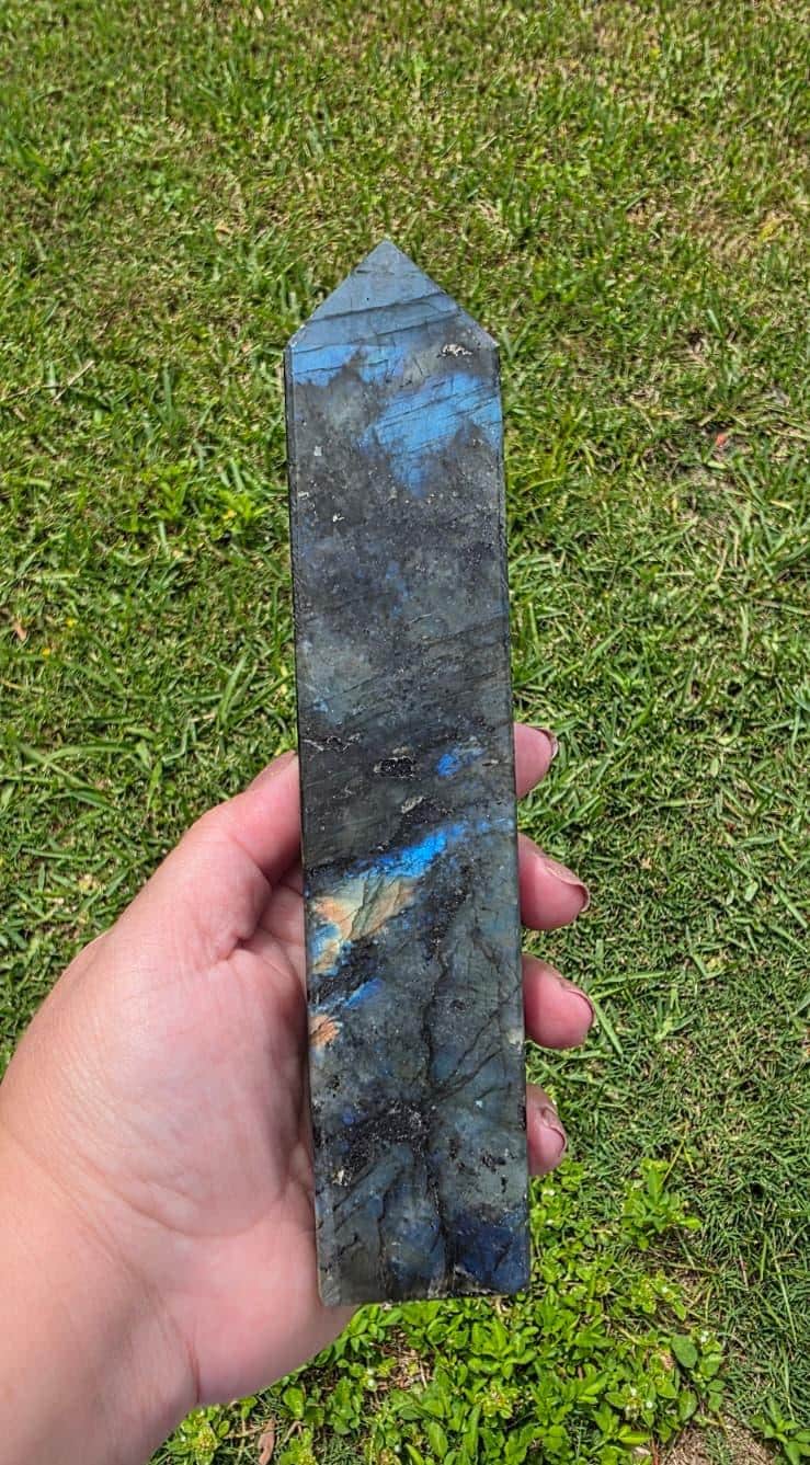 Labradorite crystal tower with pointed top, dark stone and blue flashes
