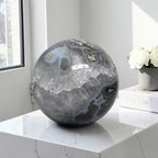 Moss agate geode sphere with gray-blue crystal matrix, green inclusions, and white druzy