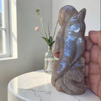 Dolphin crystal sculpture with purple-blue iridescent finish, seated pose with raised tail