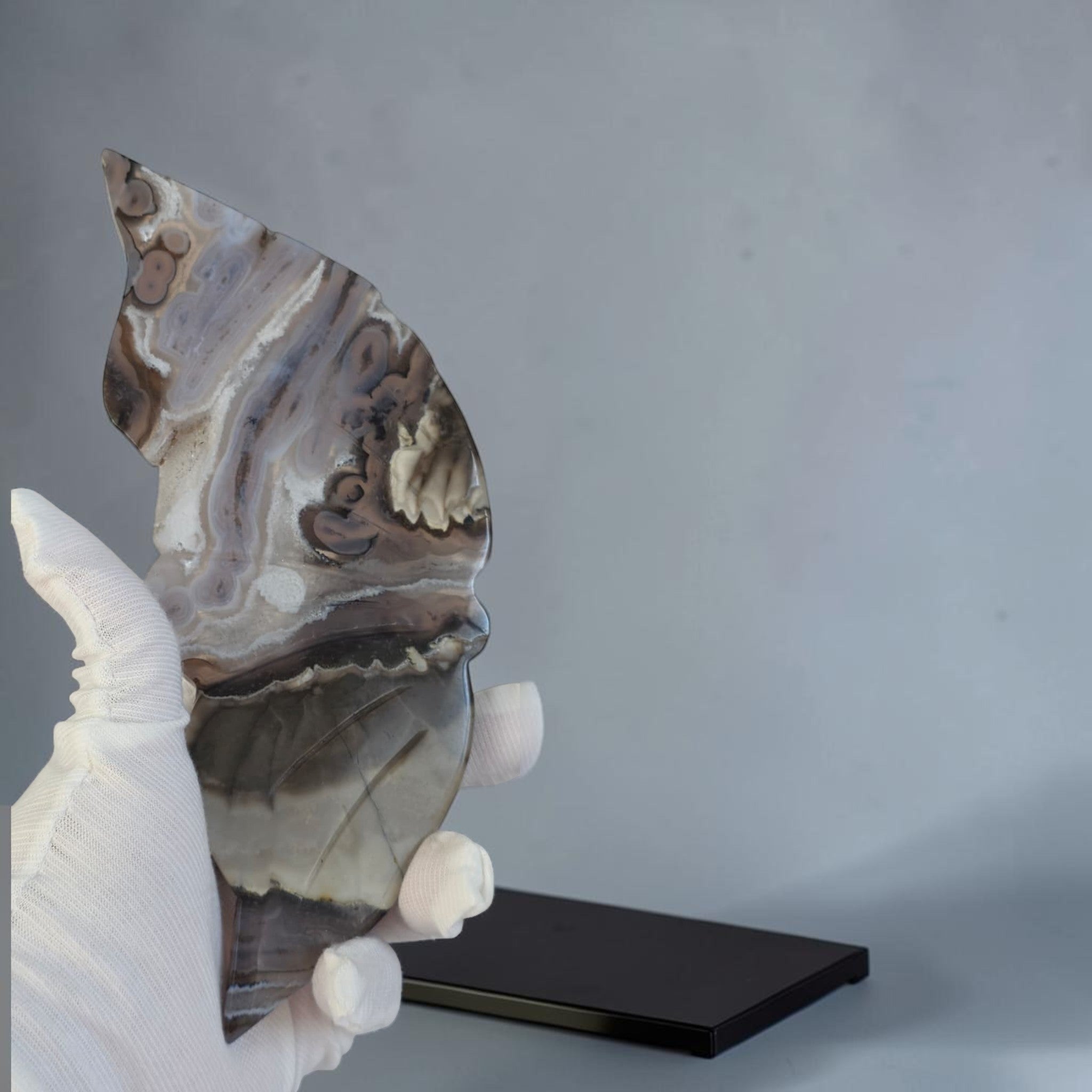 Decorative stone sculpture on a gray background
