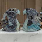 Pair of Amazonite eagle head sculptures in blue and gray stone, winged form