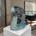 Amazonite eagle head sculpture in blue-gray stone with carved wings and beak