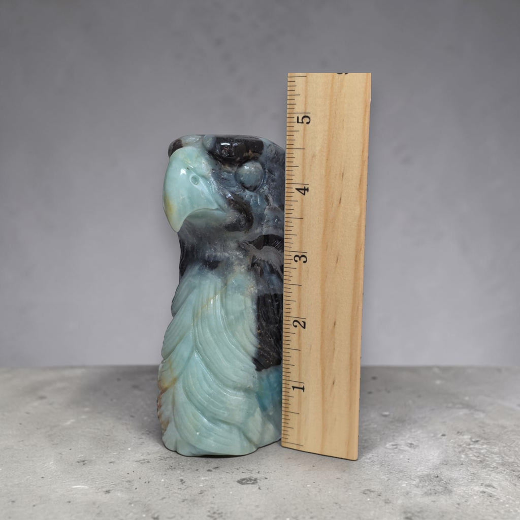Amazonite eagle head sculpture in blue-gray stone, carved beak and wing