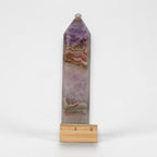 Gemstone tower with faceted top, purple-and-tan lace banding by ruler