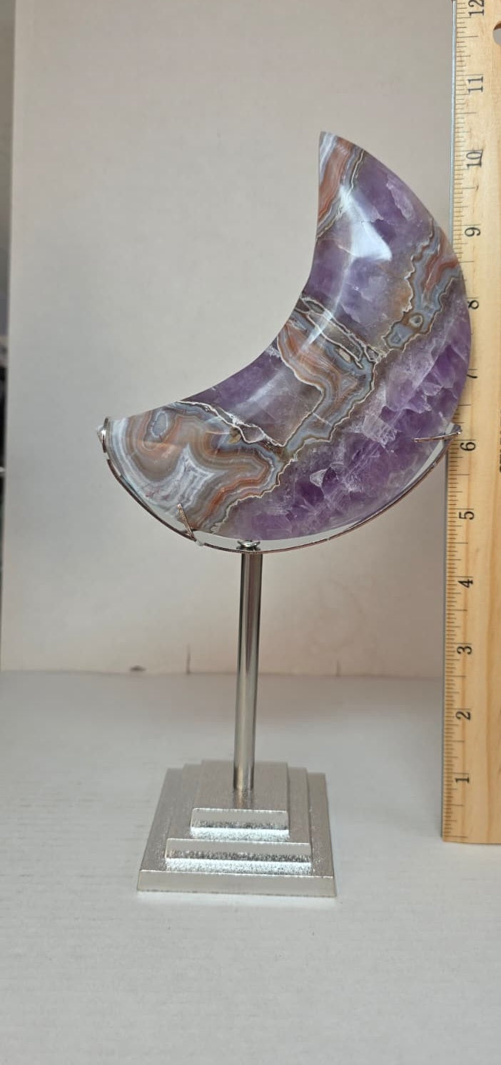Purple agate crescent moon on stand with metal ruler for size
