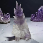 Amethyst nine-tailed fox crystal carving on white marble with amethyst clusters