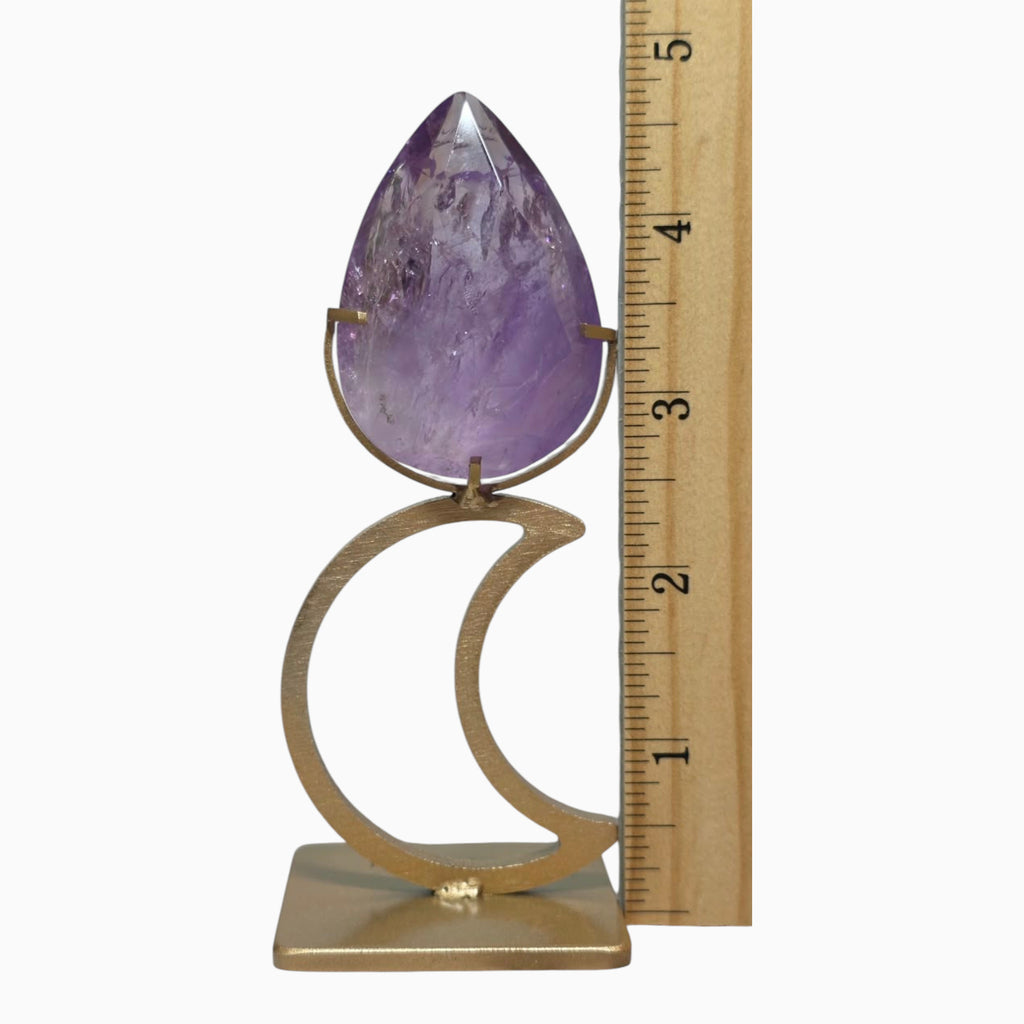 Amethyst teardrop and stand beside ruler showing approximately 4.5 inches total height