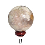 Flower agate drusy sphere on dark red base, pale gray-pink with white crystal speckles