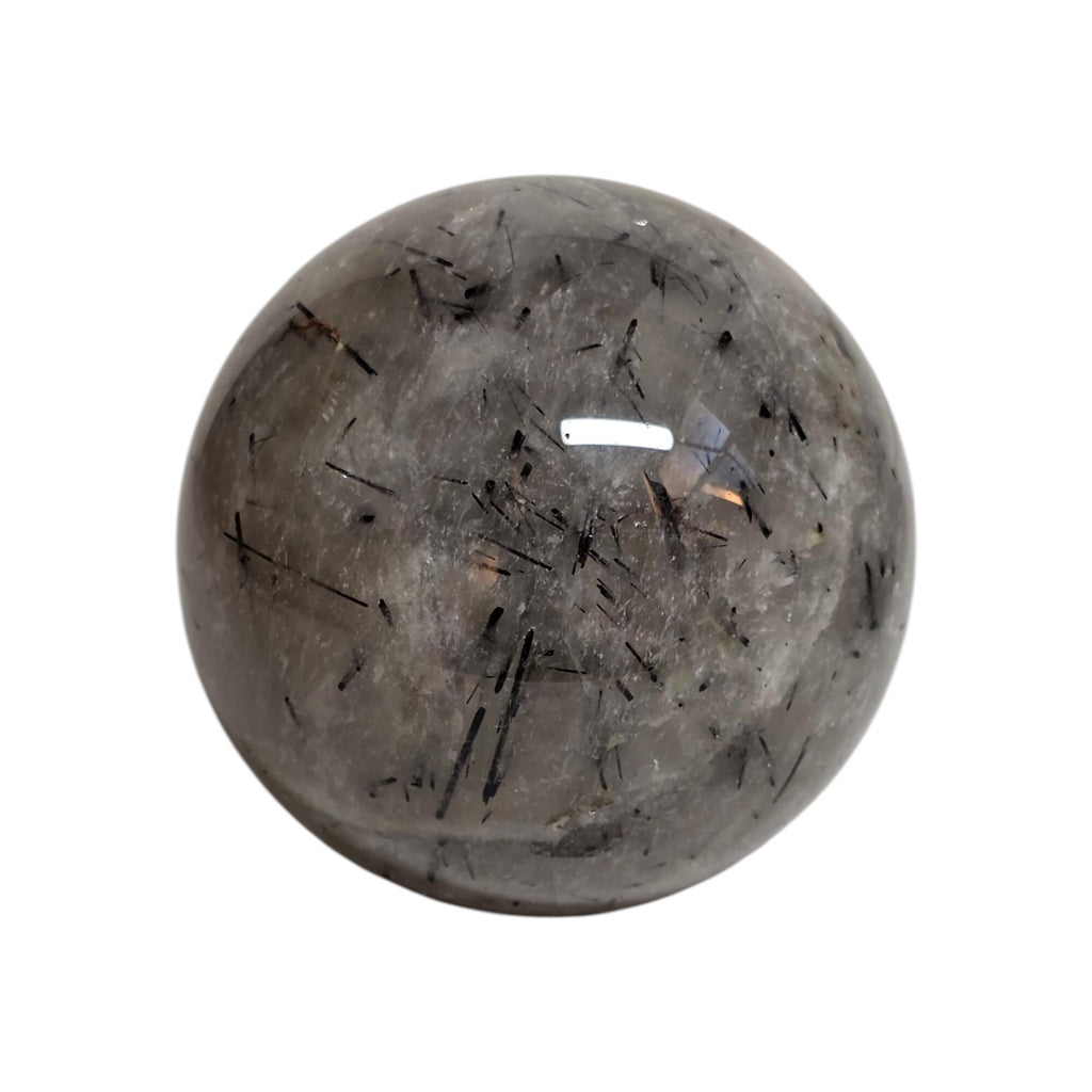 Polished gray rutilated quartz sphere with black needle-like inclusions and glossy finish