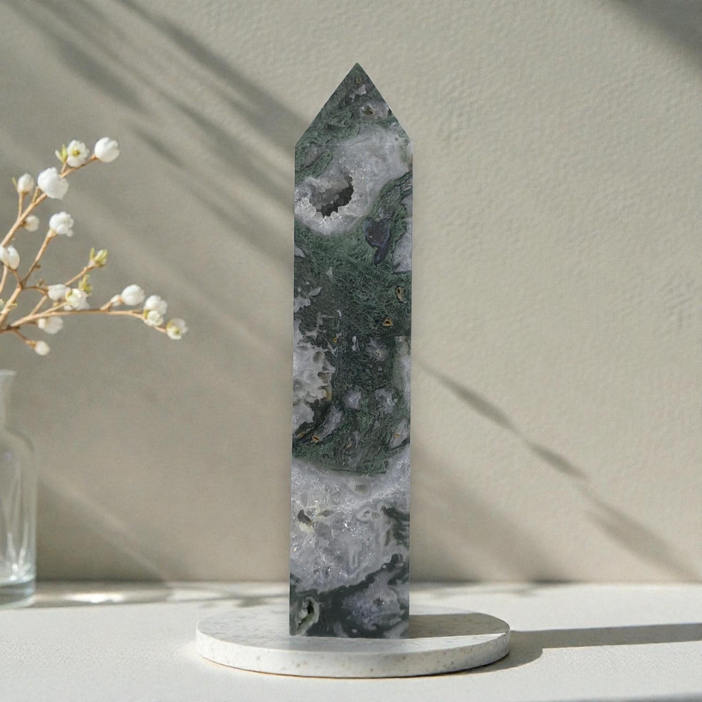 Moss agate crystal obelisk with pointed top, druzy white pocket and dark green patches