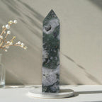 Moss agate crystal obelisk with pointed top, druzy white pocket and dark green patches