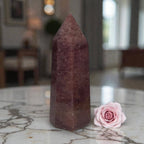 Deep red quartz crystal point tower with long pointed tip
