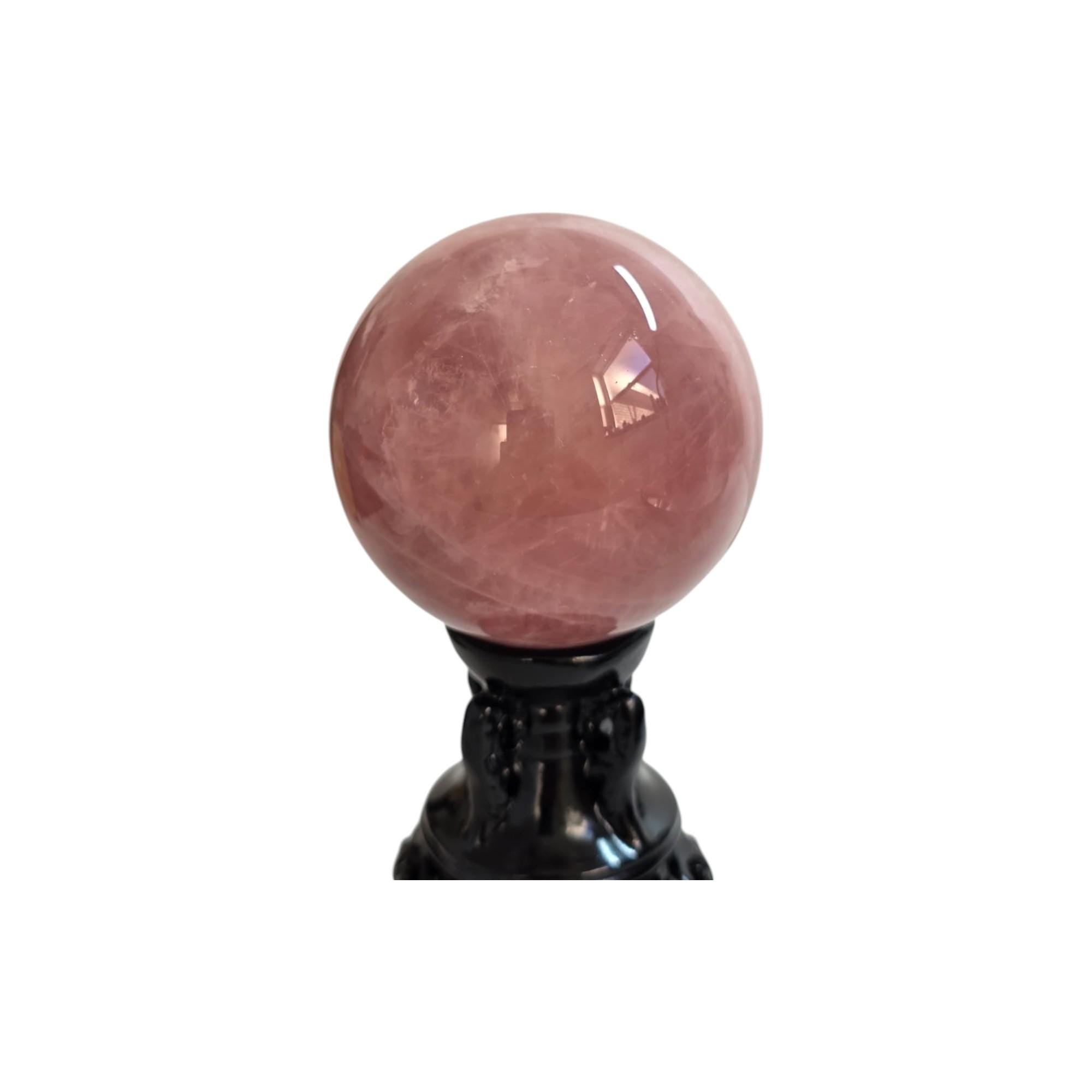 Rose quartz sphere, 73mm, on black stand, polished pink translucent gemstone
