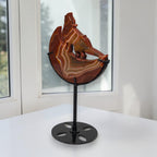 Banded agate wolf moon sculpture angle view